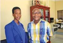  ?? / Supplied ?? Protec top achiever Lishivha Shothodzo with one of the tutors.