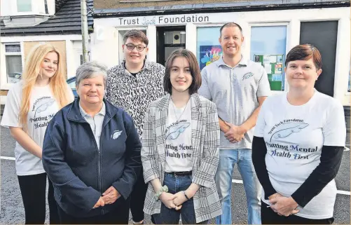  ?? ?? Building trust Volunteers, from left, Claire Hossack and Karen Harding, board member Aaron Sweeney, volunteers Sammi Mitchell and Michael Hossack, and secretary Janet Walsh