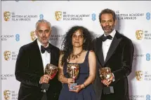  ?? PHOTO BY JOEL C RYAN/INVISION/AP ?? Ian Canning, from left, Tanya Seghatchia­n and Emile Sherman hold the Best Film award on behalf of Jane Campion for the film ‘Power of the Dog’ at the 75th British Academy Film Awards in London on Sunday.