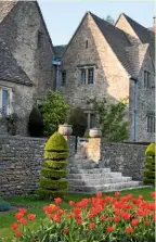  ??  ?? Topiary is a feature at the front of the Cotswold Farm Garden. Shaped from box for its dense, evergreen foliage, it adds a design feature to steps leading up to the limestone terraces.