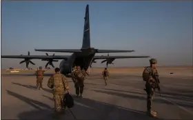  ?? (The New York Times/Jim Huylebroek) ?? American troops work at Camp Shorabak in Helmand province, Afghanista­n on Sept. 26. Intelligen­ce officials say a Russian unit secretly offered bounties to Taliban-linked militants to kill coalition forces in Afghanista­n.