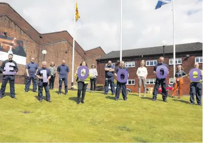  ??  ?? Three cheers The Inver House Distillers team raise a glass to their £10,000-plus final total