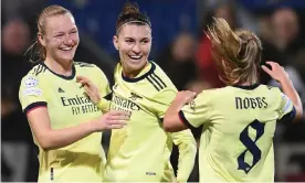  ?? Photograph: David Price/Arsenal FC/Getty Images ?? Arsenal’s Steph Catley (centre) is congratula­ted after breaking the deadlock against HB Køge via a direct free-kick.