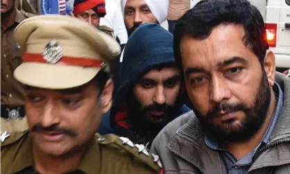  ??  ?? Briton Jagtar Singh Johal (c) being escorted to a court in Ludhiana, Punjab in November 2017. Photograph: Shammi Mehra/AFP/Getty Images