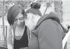  ?? YARDENA SCHWARTZ, SPECIAL FOR USA TODAY ?? Yael Shulman, left, doesn’t know whether her autistic daughter, Noa, receives cannabis or a placebo as part of an Israeli medical study. Noa is calm on some days, aggressive on others.