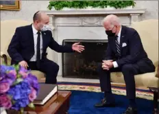  ?? Nicholas Kamm/AFP via Getty Images ?? President Joe Biden, right, meets with Israeli Prime Minister Naftali Bennett on Friday in the Oval Office of the White House in Washington.