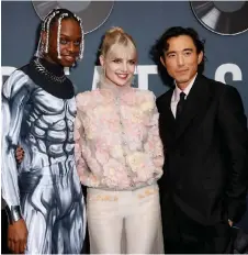  ?? — AFP photo ?? (From left) US actor and singer Austin Crute, Lucy Boynton and Justin H. Min attend Searchligh­t Pictures “The Greatest Hits” premiere at El Capitan Theatre in Hollywood, California.