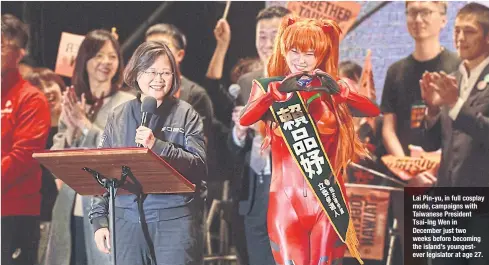  ??  ?? Lai Pin-yu, in full cosplay mode, campaigns with Taiwanese President Tsai-Ing Wen in December just two weeks before becoming the island’s youngestev­er legislator at age 27.