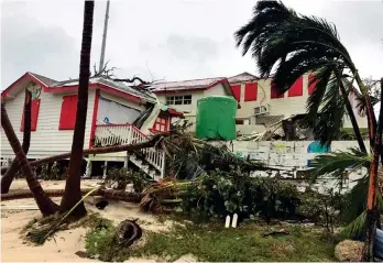  ??  ?? Destructiv­e force: One of the thousands of homes destroyed by Hurricane Dorian