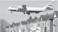  ?? JUSTIN TALLIS, AFP/GETTY IMAGES ?? A British Airways 747 prepares to land at London’s Heathrow Airport on Feb. 18. As the jet approaches, pilots slow the plane.