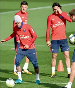  ??  ?? Paris Saint-Germain’s Neymar (left) with team mate Edinson Cavani (right) at a training session in Saint-Germain-en-Laye on Thursday. —