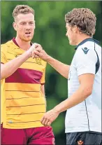  ??  ?? Motherwell’s Jordan White and Dundee United’s Louis Appere at full-time of yesterday’s friendly match