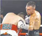  ?? Mikey Williams Top Rank ?? Bantamweig­ht Jason Moloney, right, called his victory over Leonardo Baez on Thursday “the greatest moment of my career.”