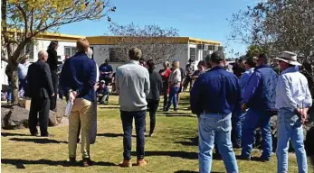  ?? PHOTO: MICHAEL DOYLE ?? SAD TIMES: Ostwald Bros workers gather for an emergency meeting in Dalby.