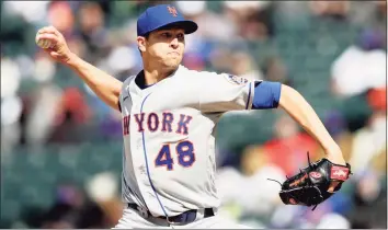  ?? Matthew Stockman / Getty Images ?? Mets starting pitcher Jacob deGrom delivers against the Rockies in the first game of Saturday’s doublehead­er.