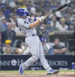  ?? GREGORY BULL — THE ASSOCIATED PRES ?? The Dodgers’ Will Smith follows through on a home run during the eighth inning Wednesday night agains the Padres.