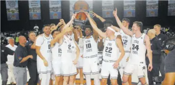  ??  ?? Members of the Utah State University team show off their trophy after winning the Montego Bay Division of the Jersey Mike’s Jamaica Classic NCAA Men’s Division One basketball tournament at Montego Bay Convention Centre on Sunday.