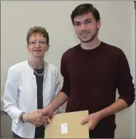  ?? Photo: Eugene Cosgrove ?? Ian France receives his Leaving Cert results from Patrician Academy, Mallow principal Catherine Fitzpatric­k on Wednesday.