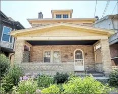  ?? PIatt Sotheby's Internatio­nal Realty ?? Brick house has wide front porch and original arched door.