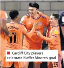  ??  ?? ■ Cardiff City players celebrate Kieffer Moore’s goal