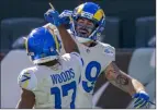  ?? Chris Szagola Th e Associated P ress ?? Rams tight end Tyler Higbee and teammate Robert Woods rejoice over a Higbee TD catch vs. the Eagles.