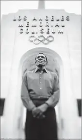  ?? Damon Winter Los Angeles Times ?? RAFER JOHNSON stands outside the Coliseum where he lit the torch to open the 1984 Games.