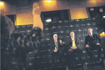  ?? Mason Trinca / Special to The Chronicle ?? Businessma­n John Cox speaks as a moderator raises her hand at the debate among Republican candidates for governor with former Rep. Doug Ose (center) and Assemblyma­n Travis Allen.