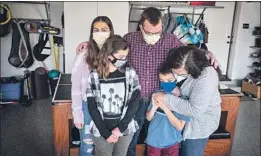  ?? Allen J. Schaben Los Angeles Times ?? BOBBY SASSON, right, was recently reunited with her children, Asha, 14, Mira, 10, and Aneel, 7, and her husband, Andrew Highsmith, after a year apart.