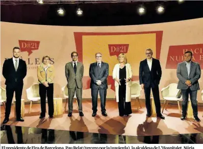  ?? David Oller / Europa Press ?? El presidente de Fira de Barcelona, Pau Relat (tercero por la izquierda), la alcaldesa de L’Hospitalet, Núria Marín (centro), y Marc Puig, CEO de Puig (segundo por la derecha), entre los participan­tes en el debate, ayer.