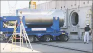  ?? Dominion Resources / AP file photo ?? A spent fuel storage container is offloaded from a trailer into a horizontal storage module at the Millstone Power Station in Waterford in 2012.