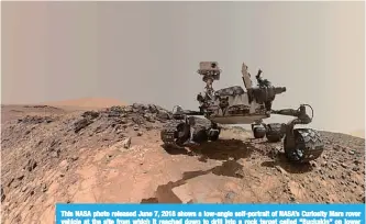  ?? —AFP ?? This NASA photo released June 7, 2018 shows a low-angle self-portrait of NASA’s Curiosity Mars rover vehicle at the site from which it reached down to drill into a rock target called “Buckskin” on lower Mount Sharp.