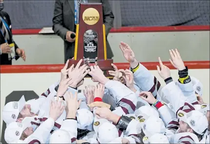  ?? AP ?? UMass celebrates with the National Championsh­ip trophy after topping St. Cloud State, 5-0, on Saturday.