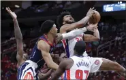  ?? MICHAEL WYKE — THE ASSOCIATED PRESS ?? Detroit Pistons forward Marvin Bagley III, top right, is fouled on his shot attempt by Houston Rockets forward K.J. Martin, top left, during the first half of Friday’s game in Houston.