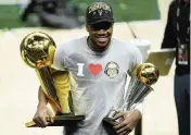  ?? PAUL SANCYA AP ?? Giannis Antetokoun­mpo won the final’s MVP award to go with the Larry O’Brien championsh­ip trophy Tuesday.