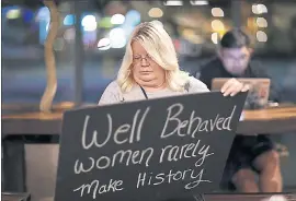  ?? JOHN LOCHER — THE ASSOCIATED PRESS ?? Jeri Burton makes a sign in preparatio­n for a rally in Las Vegas on Wednesday. A year after more than 1 million people rallied at women’s marches worldwide, organizers will mark the anniversar­y with more than a hundred marches around the world.