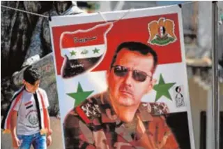 ?? AFP ?? Cartel de Bashar al Assad en una aldea drusa del Golán