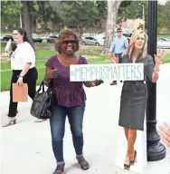  ??  ?? Memphian Felecia Boyd stands next to a cutout of GOP Senate candidate Marsha Blackburn at Rhodes College's McNeill Hall on Thursday. JOE RONDONE/THE COMMERCIAL APPEAL