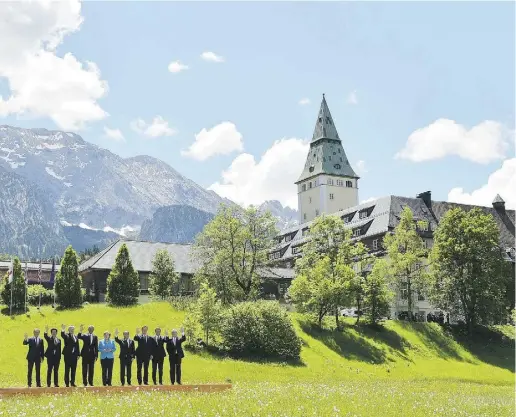  ?? MANDEL NGAN / AFP / Gett y Images ?? Prime Minister Stephen Harper, third from left, poses for a photo with German Chancellor Angela Merkel, centre, and
other leaders during the G7 summit at the Elmau Castle resort near Garmisch-Partenkirc­hen, Germany, on Sunday.