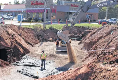  ?? SUBMITTED PHOTO ?? A trench has been dug diagonal through the intersecti­on of North River Road in Charlottet­own in preparatio­n for the large concrete box sections being moved into the trench early next week.