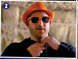  ?? ?? 2
CLOWN PRINCE: Harry tries to speak Dutch in a video call (1), then dons a hat and shades (2) and reveals T-shirt and shorts (3)