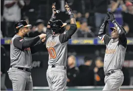  ?? MATT ROBERTS / GETTY IMAGES ?? The Netherland­s’ Didi Gregorius (right) celebrates his three-run homer with teammates in Monday’s 12-2 rout of Israel in the WBC in Tokyo.