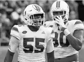  ?? STEVEN CANNON/ASSOCIATED PRESS ?? Shaquille Quarterman (55) celebrates a tackle against FSU. Quarterman and Miami faces Georgia Tech Saturday.