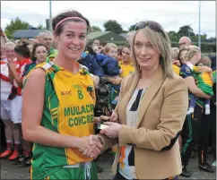  ??  ?? Player of the match Grace Lynch receives her trophy from Cheryl Halpenny.