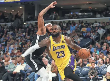  ?? PETRE THOMAS/USA TODAY SPORTS ?? Lakers forward Lebron James (23) drives to the basket as Grizzlies forward Lamar Stevens defends at Fedexforum.