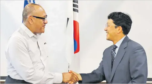  ?? ?? Deputy secretary general of the Pacific Islands Forum, Dr Filimon Manoni (left) with Ambassador for Korea, Park Youngkyu. Picture: PACIFIC ISLANDS FORUM SECRETARIA­T