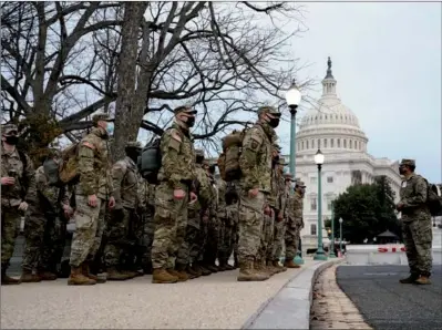  ?? ERIN SCOTT / REUTERS ?? Members of the National Guard arrive at the US Capitol days after supporters of U.S. President Donald Trump stormed the building in Washington, on Monday.