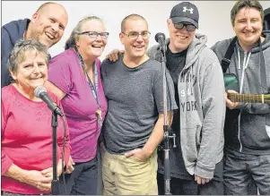  ?? STEPHEN BRUN/THE GUARDIAN ?? Members of the Island Media Arts Cooperativ­e mental health stand-up comedy group, from left, Margie MacGilliva­ry, Dave Hicks, Madge Mossberg, Ryan Gallant, Brenlae MacMillan and Andrew Campbell yuck it up at the microphone­s while rehearsing for their...