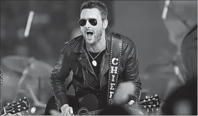  ?? Associated Press ?? n Country music singer Eric Church performs at halftime during an NFL football game between the Washington Redskins and Dallas Cowboys on Nov. 24, 2016, in Arlington, Texas.