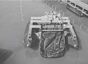  ?? MEG VOGEL/THE ENQUIRER ?? Clean Earth Rovers’ Plastics Piranha aquatic rover navigates the Rivertowne Marina in the East End during a test. Clean Earth Rovers is working to clean marinas to help reduce water pollution. The rover can collect up to 300 pounds of waste per trip.