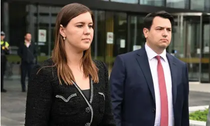  ?? Photograph: Mick Tsikas/AAP ?? Brittany Higgins and partner David Sharaz leave the ACT supreme court after Higgins gave evidence in the trial of her alleged rapist on Thursday.